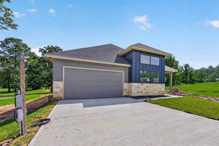 Front exterior of a new home in , Huntsville, TX, highlighting curb appeal (Image 20).