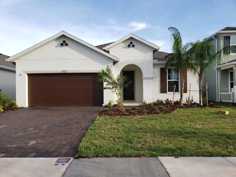 Front exterior of a new home in Pennyroyal, Kissimmee, FL, highlighting curb appeal (Image 1). Front exterior of a new home in Pennyroyal, Kissimmee, FL, highlighting curb appeal (Image 1).