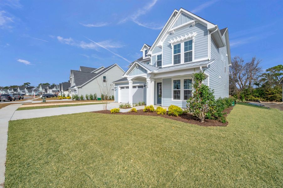 Representative exterior photo of a completed home built from the The Hampton by RobuckHomes in Windwater, Hampstead, NC (Image 31).