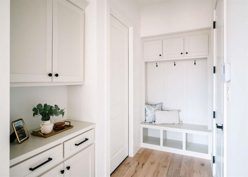 Mudroom featuring light wood-type flooring