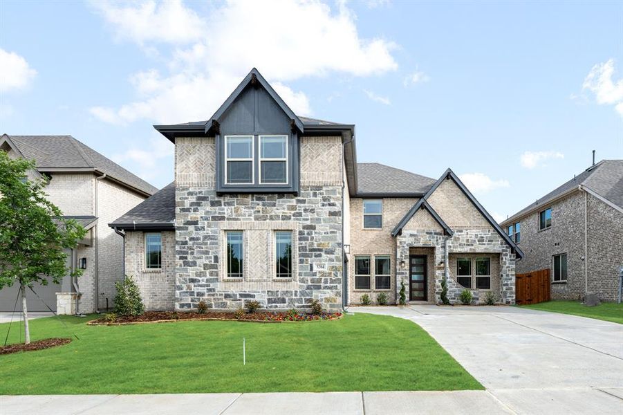 Front exterior of a new home in Glenwood Meadows, Argyle, TX, highlighting curb appeal (Image 2).