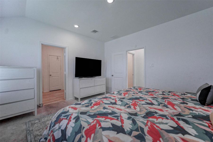 Spacious primary bedroom with two closets and private ensuite bath. Natural light and quiet comfort in Sunterra, Katy’s resort-style neighborhood. Spacious primary bedroom with two closets and private ensuite bath. Natural light and quiet comfort in Sunterra, Katy’s resort-style neighborhood.