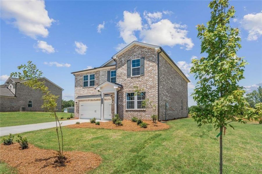 Front exterior of a new home in Walker Grove, McDonough, GA, highlighting curb appeal (Image 18). Front exterior of a new home in Walker Grove, McDonough, GA, highlighting curb appeal (Image 18).
