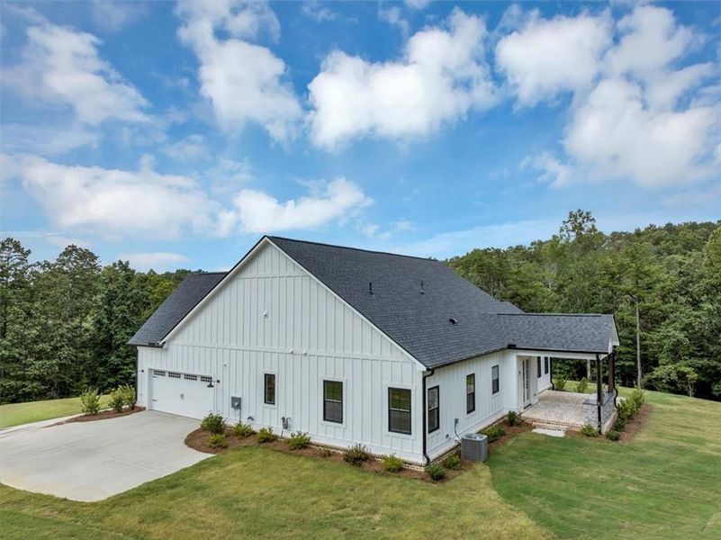Front exterior of a new home in , Ball Ground, GA, highlighting curb appeal (Image 23).