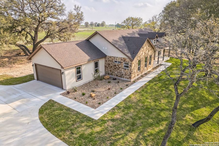 Front exterior of a new home in , Floresville, TX, highlighting curb appeal (Image 17). Front exterior of a new home in , Floresville, TX, highlighting curb appeal (Image 17).