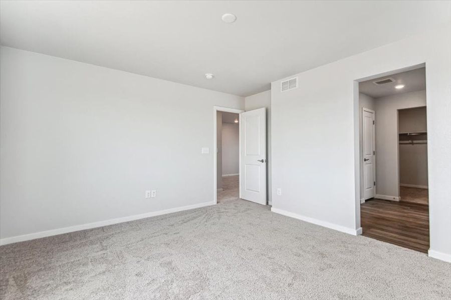 A hallway with white walls.