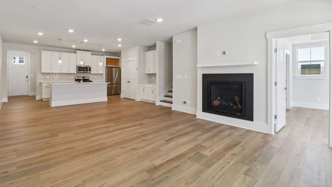 The Awaken Plan by DRB Elevate in Brook Run, Fort Mill SC - Living Space & Kitchen The Awaken Plan by DRB Elevate in Brook Run, Fort Mill SC - Living Space & Kitchen