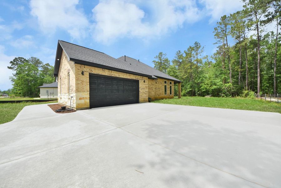 Front exterior of a new home in , Dayton, TX, highlighting curb appeal (Image 16).