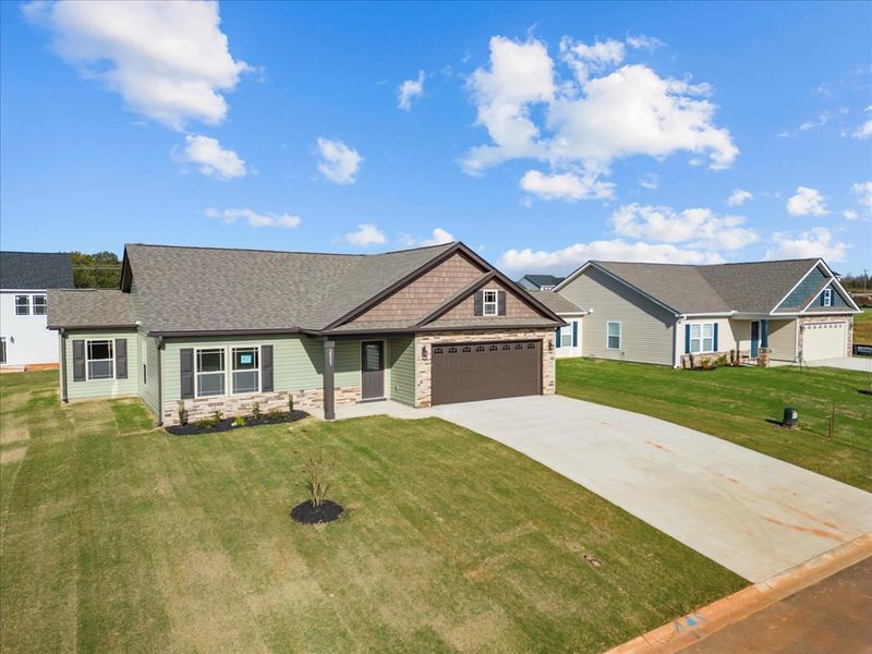 Representative exterior photo of a completed home built from the Rozlynn by Enchanted Homes in Guadalupe Heights, Seguin, TX (Image 23).