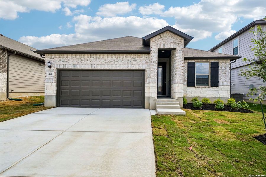 Front exterior of a new home in Legendary Trails - Premier Series, Cibolo, TX, highlighting curb appeal (Image 2). Front exterior of a new home in Legendary Trails - Premier Series, Cibolo, TX, highlighting curb appeal (Image 2).