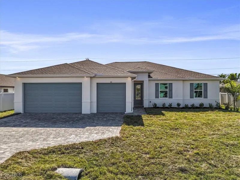 Front exterior of a new home in Cape Coral, Cape Coral, FL, highlighting curb appeal (Image 2). Front exterior of a new home in Cape Coral, Cape Coral, FL, highlighting curb appeal (Image 2).