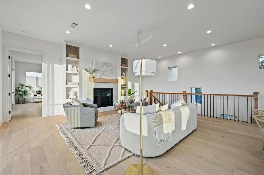 Imagine unwinding at the end of a long day in front of the designer fireplace and enjoying the peaceful views from this warm and inviting living room.