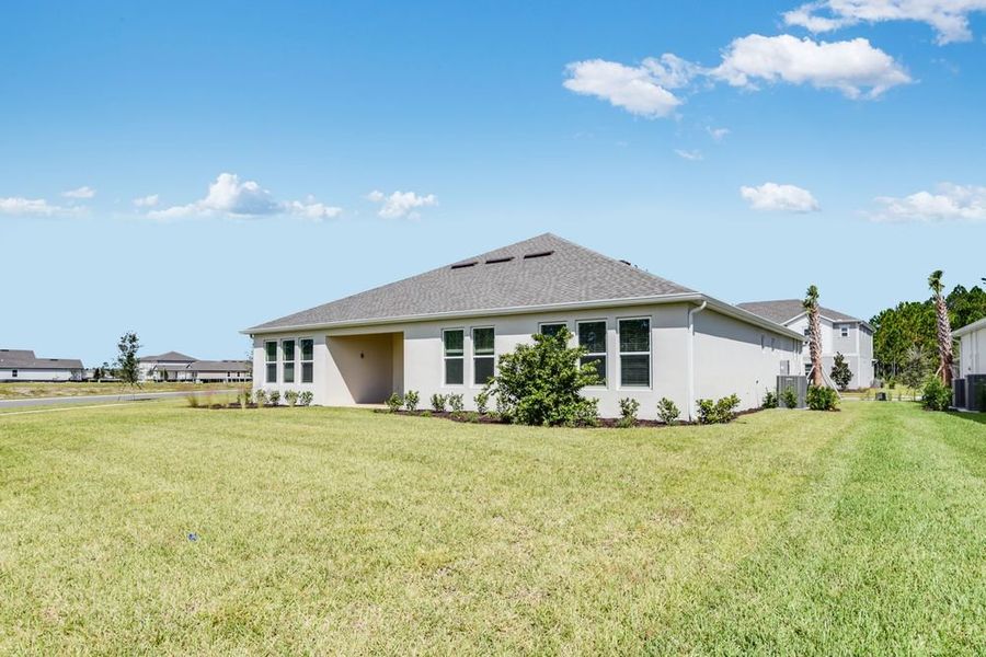 Exterior details and patio area of a home in Ardisia Park, New Smyrna Beach (Image 19).