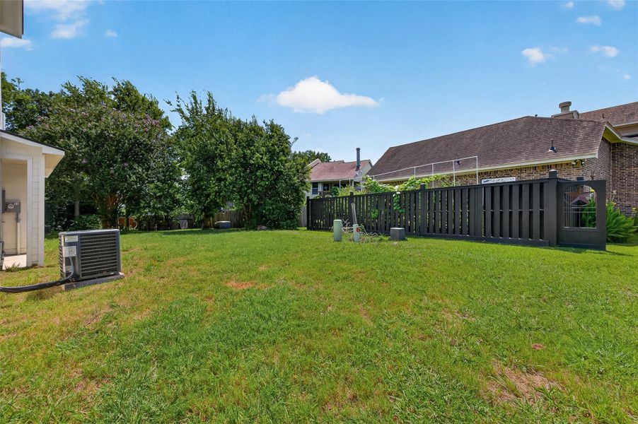 Exterior details and patio area of a home in , Conroe (Image 3).