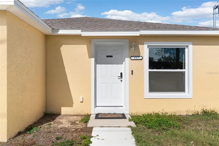 Exterior details and patio area of a home in , Auburndale (Image 3).