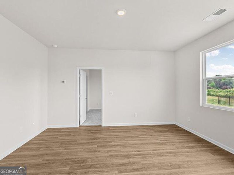 Spacious, unfurnished interior of a new home in Remington Chase, Perry (Image 14).