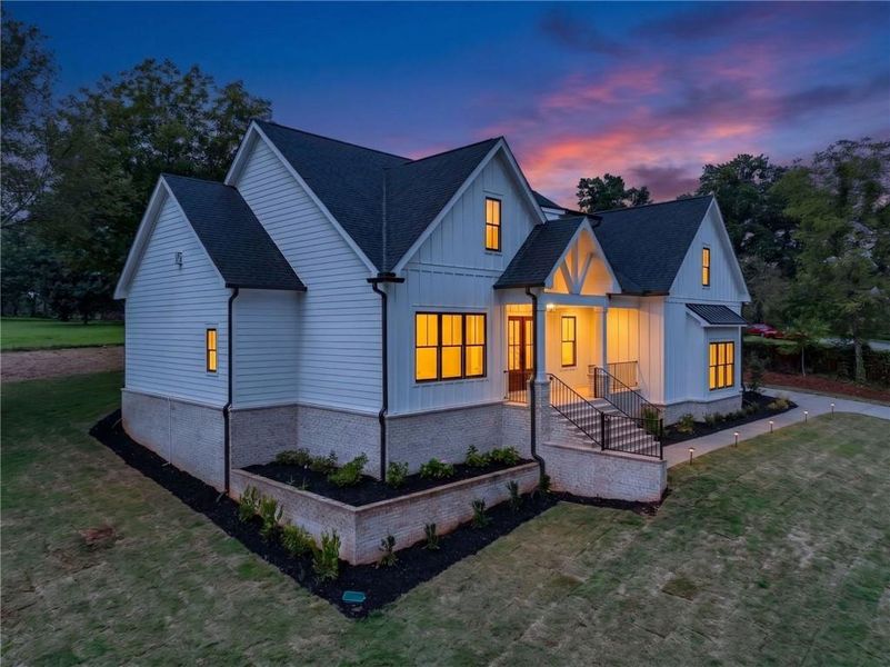 Front exterior of a new home in , Cumming, GA, highlighting curb appeal (Image 2). Front exterior of a new home in , Cumming, GA, highlighting curb appeal (Image 2).