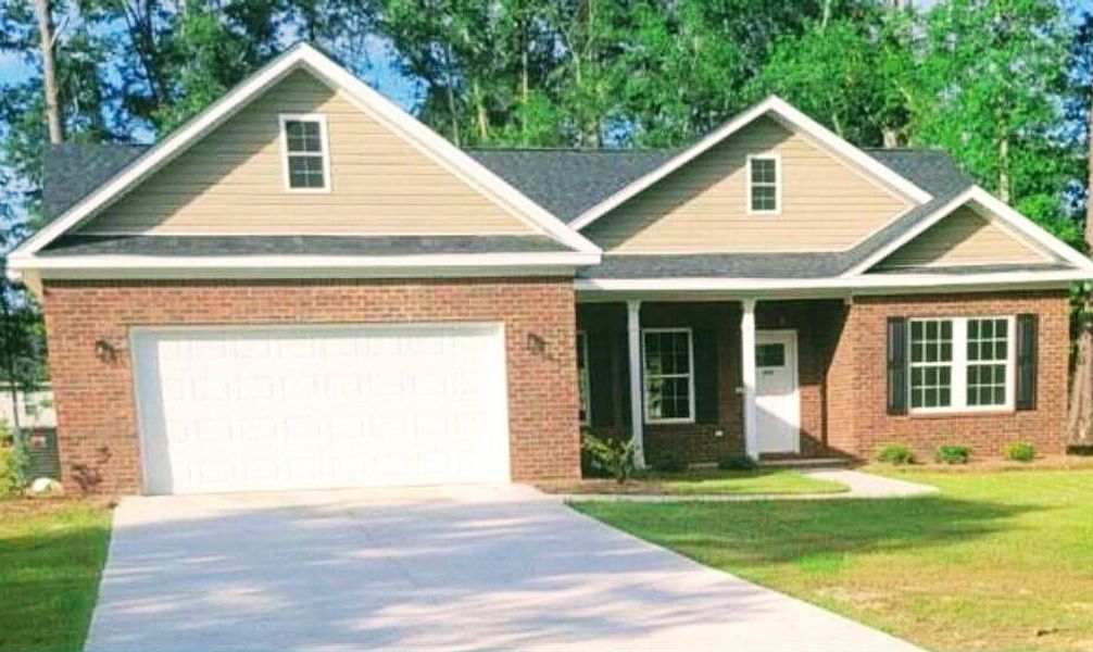 Front exterior of a new home in , Orangeburg, SC, highlighting curb appeal (Image 1). Front exterior of a new home in , Orangeburg, SC, highlighting curb appeal (Image 1).