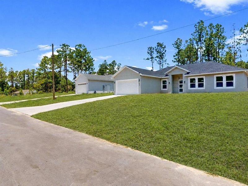 Front exterior of a new home in , Ocala, FL, highlighting curb appeal (Image 2). Front exterior of a new home in , Ocala, FL, highlighting curb appeal (Image 2).