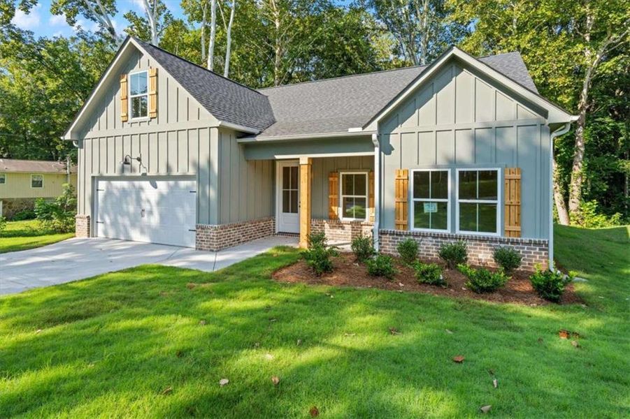 Front exterior of a new home in , Temple, GA, highlighting curb appeal (Image 21).