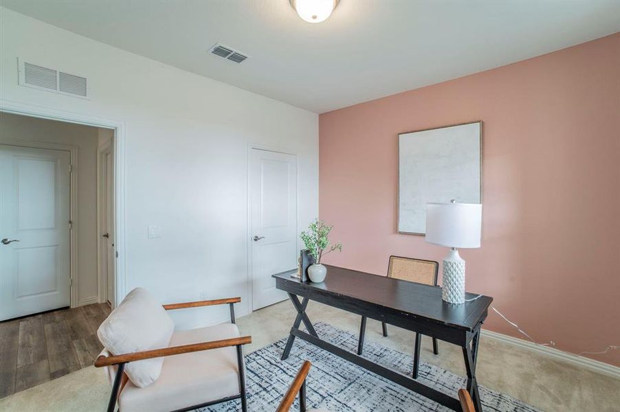 Carpeted office space featuring baseboards Carpeted office space featuring baseboards