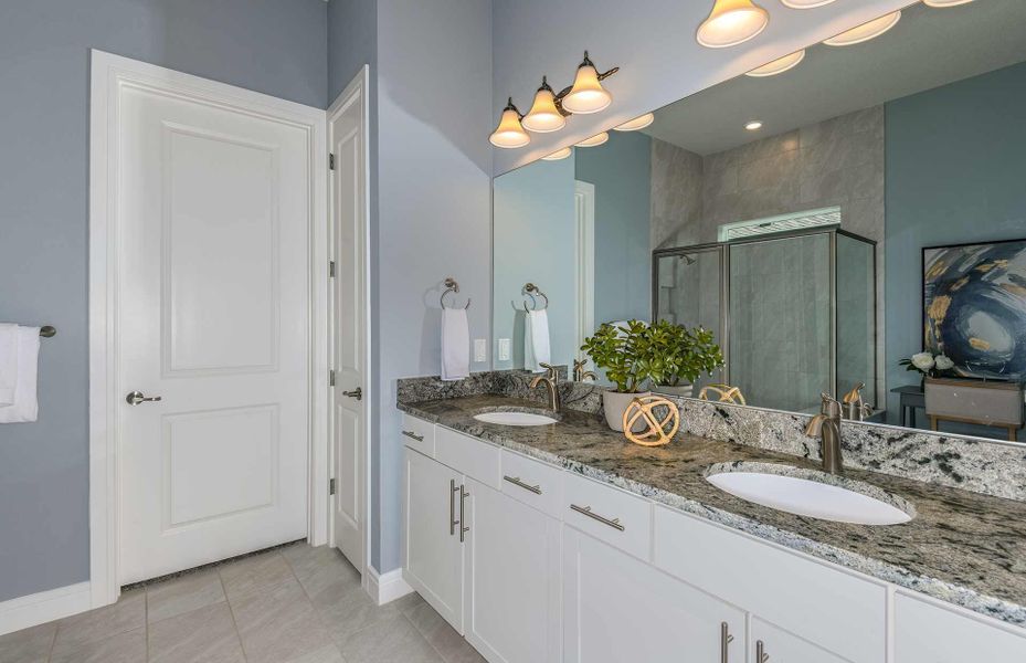 Owner's Bathroom with Dual Sinks and Ample Cabinets for Storage