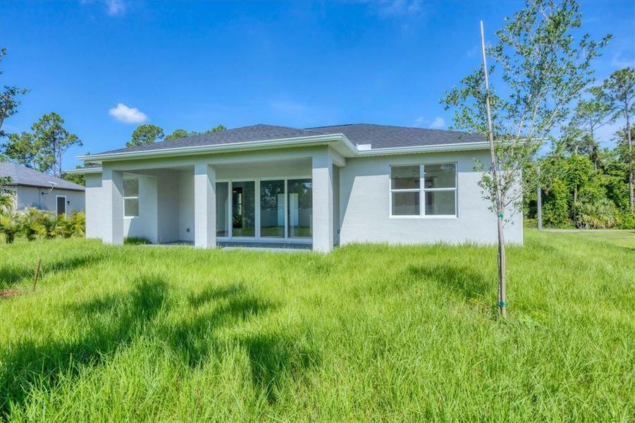 Front exterior of a new home in , North Port, FL, highlighting curb appeal (Image 1).