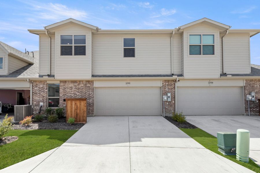 Front exterior of a new home in Cottonwood Creek, Rowlett, TX, highlighting curb appeal (Image 24).