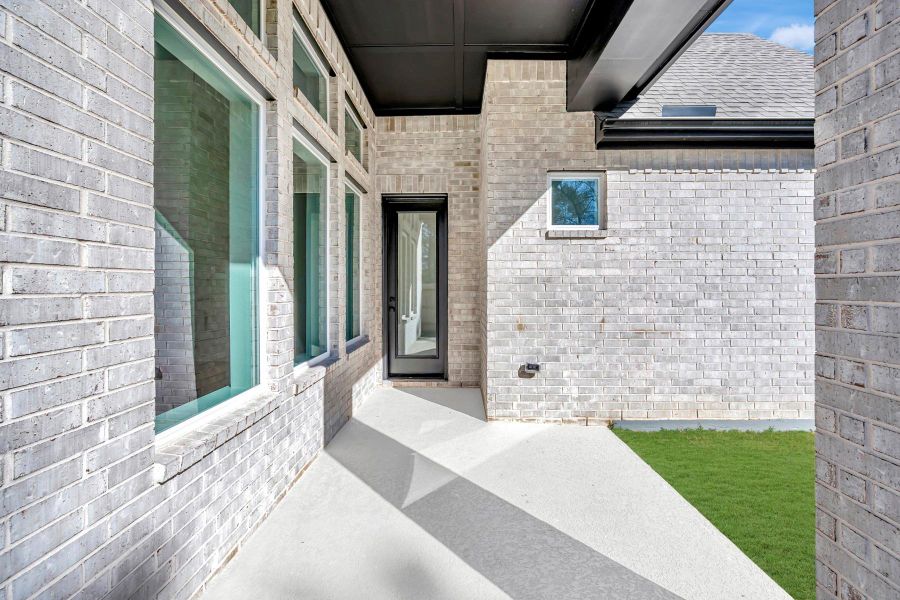 Exterior details and patio area of a home in ARTAVIA 45' Homesites, Conroe (Image 24).