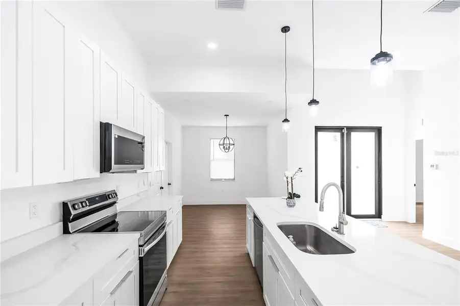 Furnished interior view inside a new home in , Clewiston (Image 7).