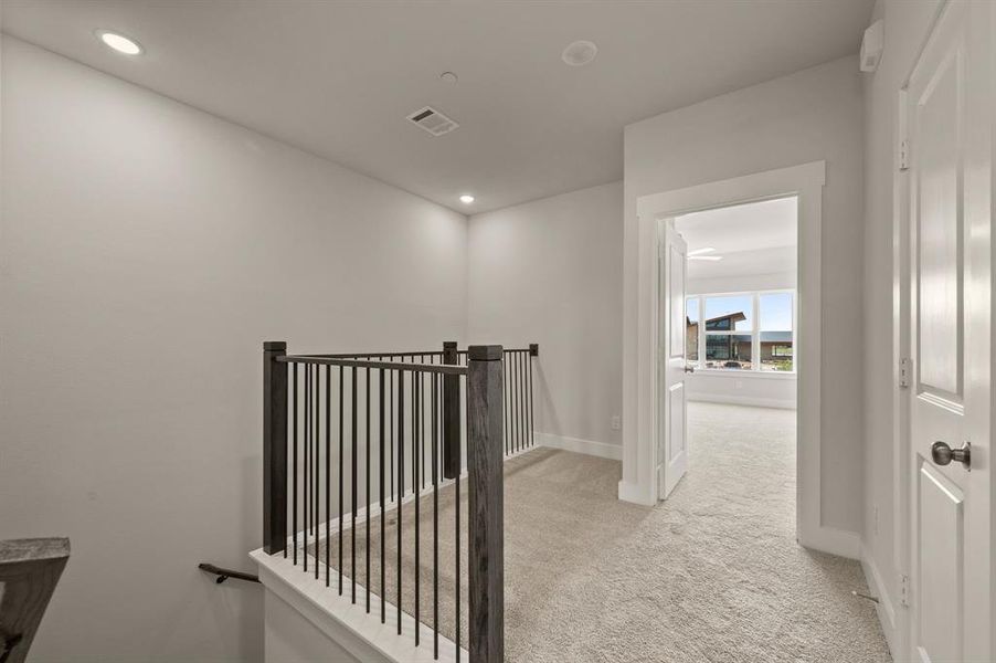 The loft at the top of the stairs makes a perfect pocket office or reading nook.