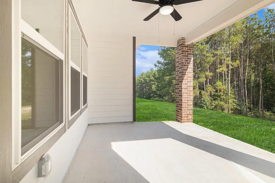 Exterior details and patio area of a home in Rose Hill Estates, Willis (Image 3).