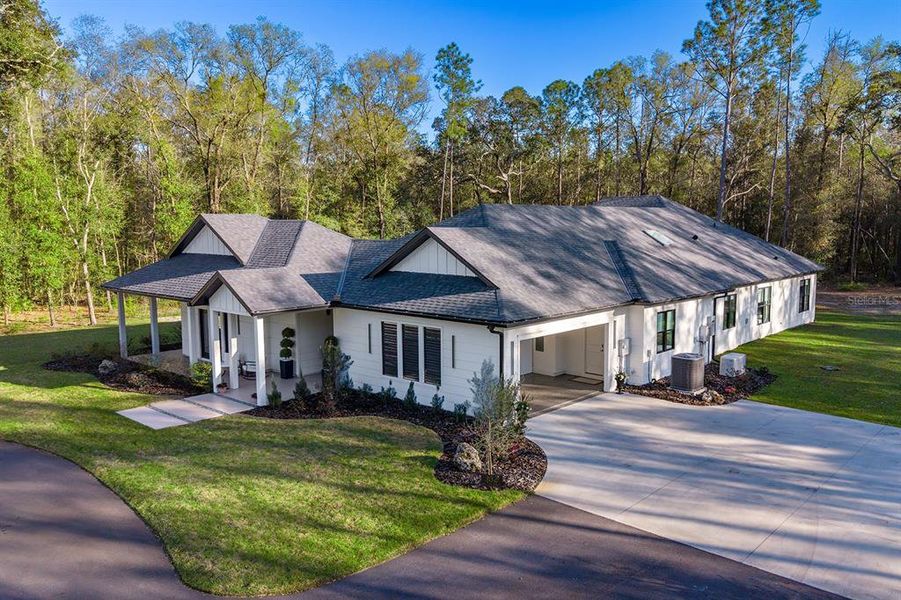 Front exterior of a new home in , High Springs, FL, highlighting curb appeal (Image 26).