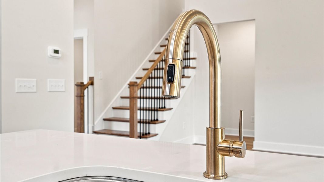 Highly skilled design choices create a clean, open kitchen with a central island in Seneca, SC