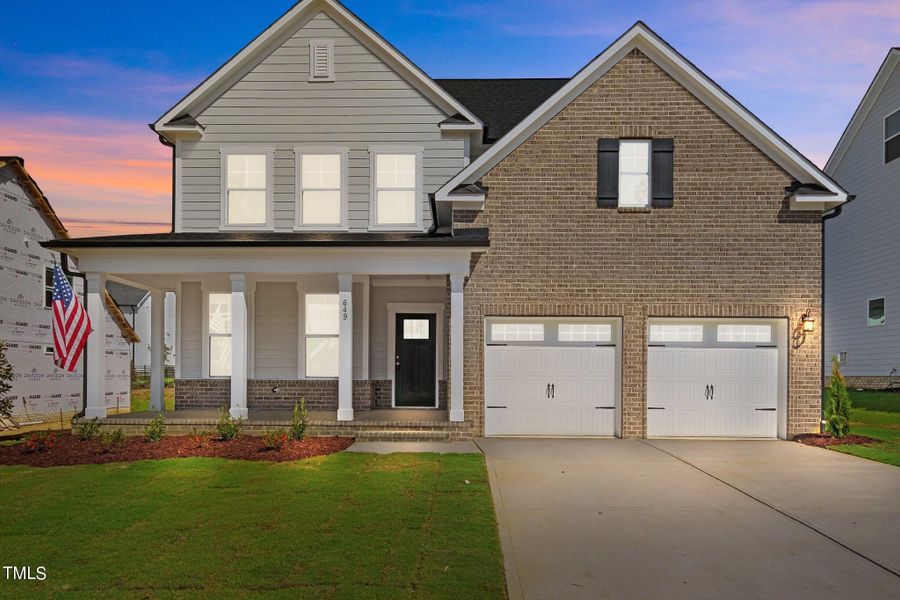 Front exterior of a new home in Glenmere, Knightdale, NC, highlighting curb appeal (Image 118). Front exterior of a new home in Glenmere, Knightdale, NC, highlighting curb appeal (Image 118).