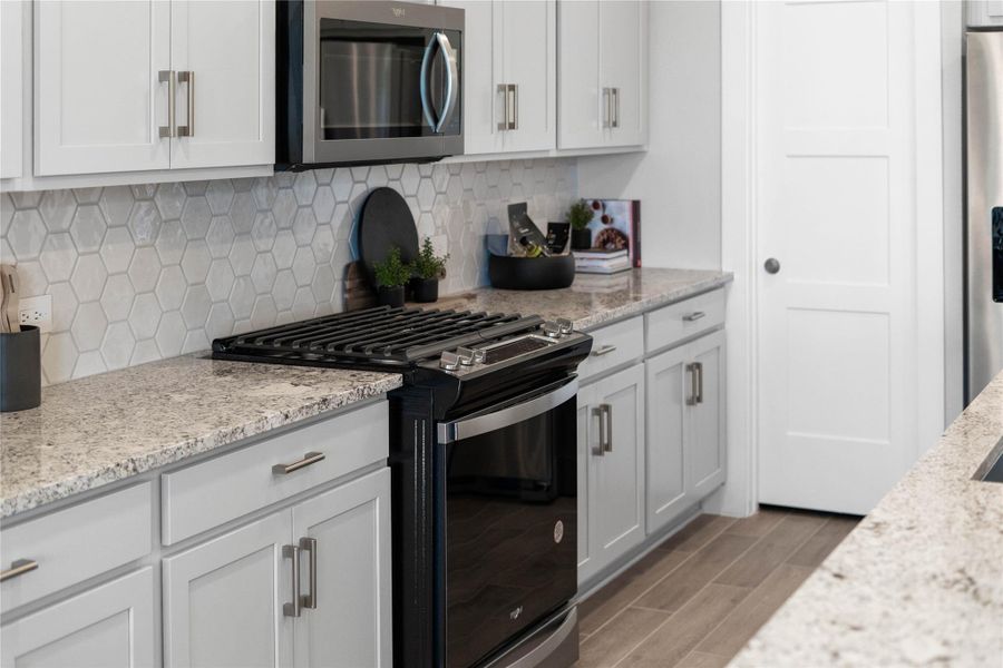 Atwell Pendant Brushed Nickel lights that hang over the kitchen island. Atwell Pendant Brushed Nickel lights that hang over the kitchen island.
