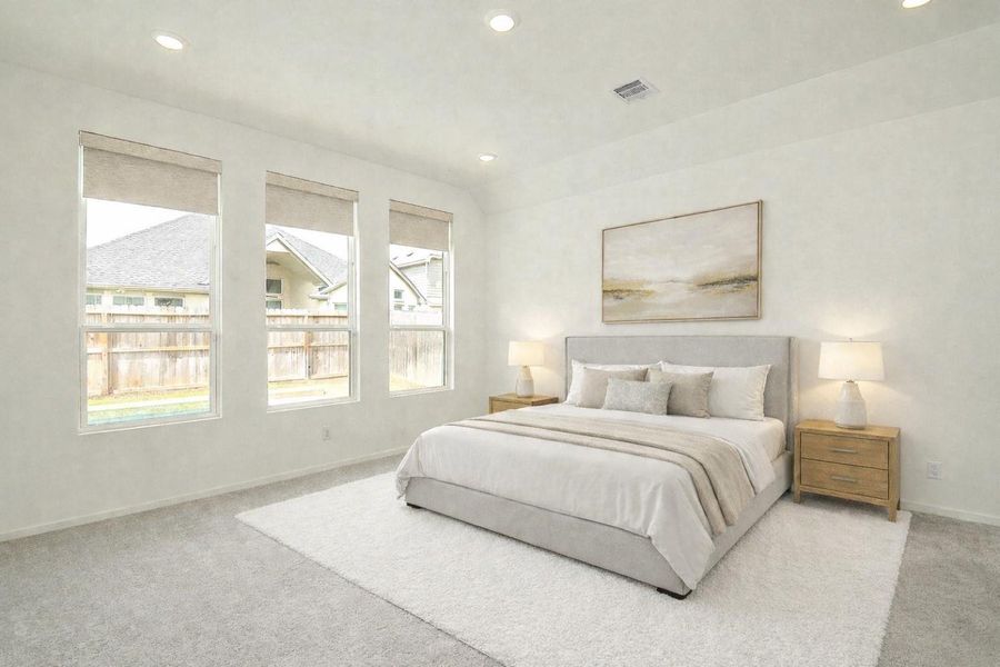 Primary bedroom with pool views! Remote control shades and recessed lighting. *virtually staged*