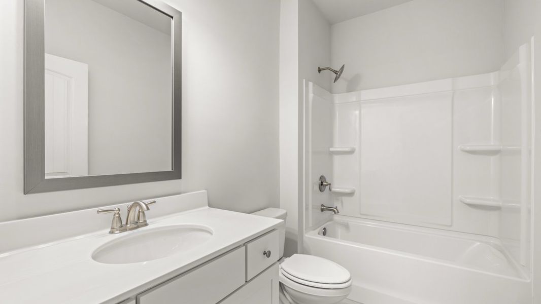 Representative furnished interior of a home built from the Caliborne by D.R. Horton in Hamptons at Riverwood North, Dallas (Image 11).