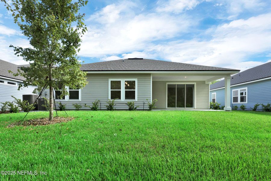 Front exterior of a new home in Trailmark - Phase 10, St. Augustine, FL, highlighting curb appeal (Image 25). Front exterior of a new home in Trailmark - Phase 10, St. Augustine, FL, highlighting curb appeal (Image 25).