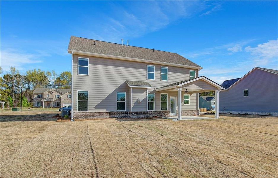 Front exterior of a new home in Copperfield, Locust Grove, GA, highlighting curb appeal (Image 19).