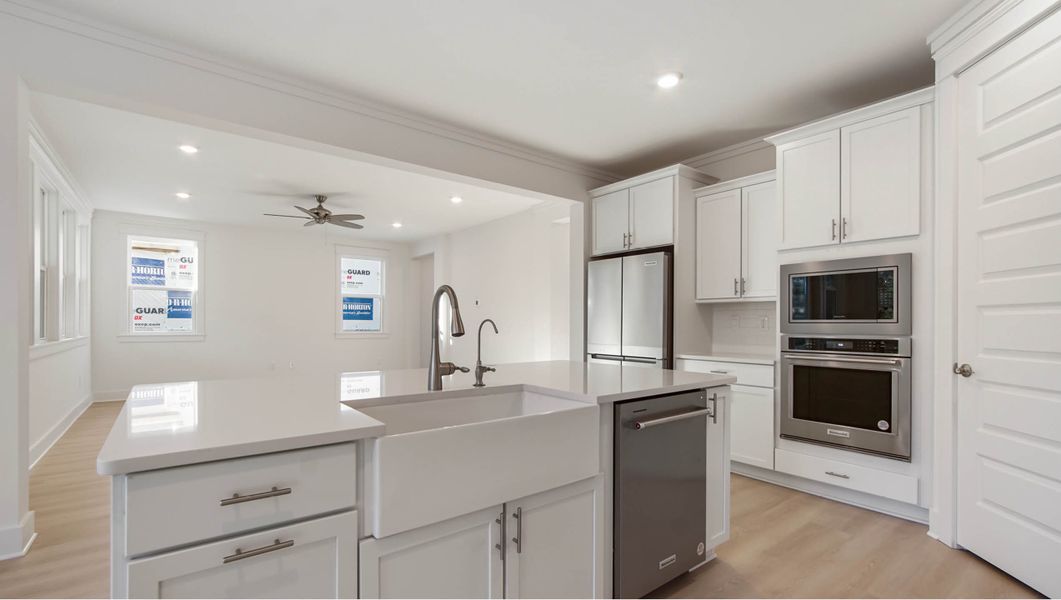 Representative furnished interior of a home built from the Ava by D.R. Horton in Parkside, Santa Rosa Beach (Image 7).