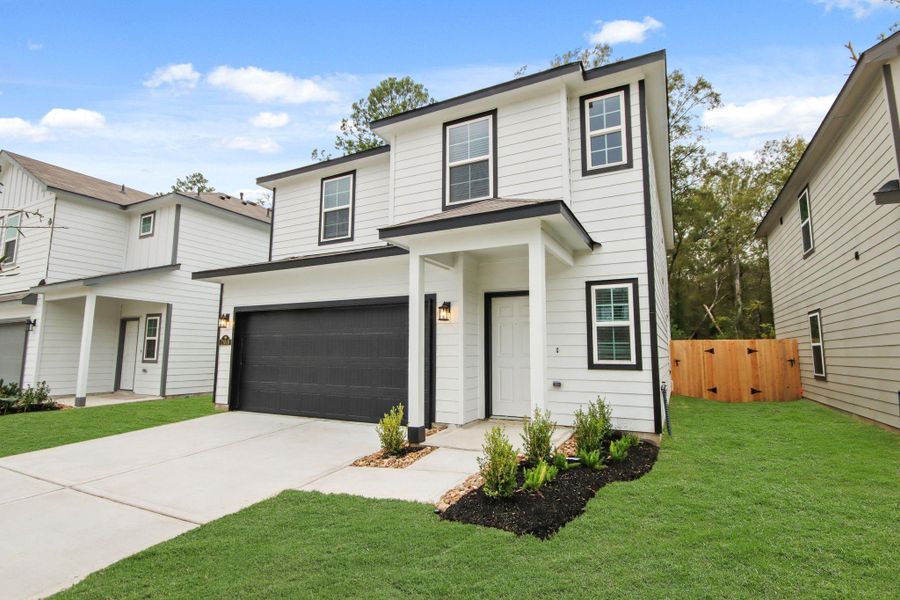 Front exterior of a new home in Maple Heights, Porter, TX, highlighting curb appeal (Image 1). Front exterior of a new home in Maple Heights, Porter, TX, highlighting curb appeal (Image 1).