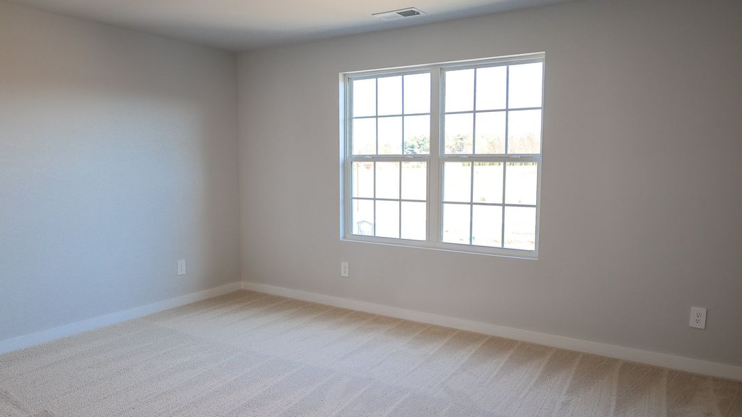 Representative unfurnished interior of a home built from the STONEBROOK II by D.R. Horton in Harvest Point, Spring Hill (Image 60).