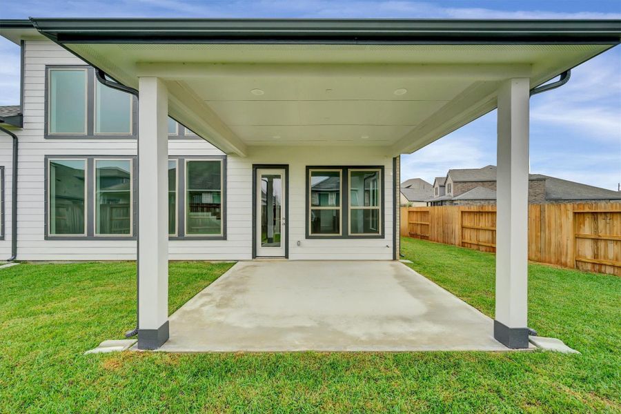 Exterior details and patio area of a home in Canterra Creek  60', Iowa Colony (Image 26).