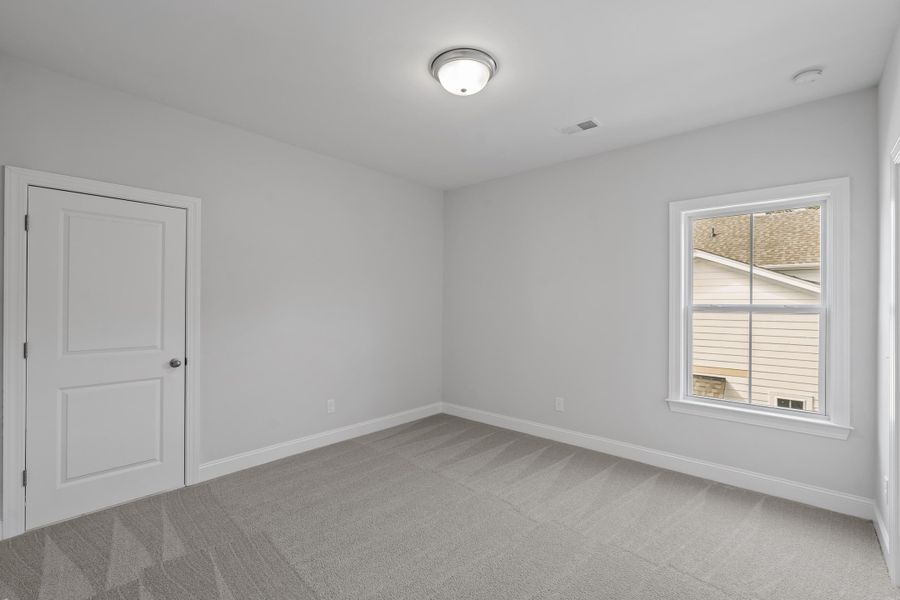 Spacious, unfurnished interior of a new home in K. Hovnanian's® Four Seasons at Lakes of Cane Bay, Summerville (Image 22).