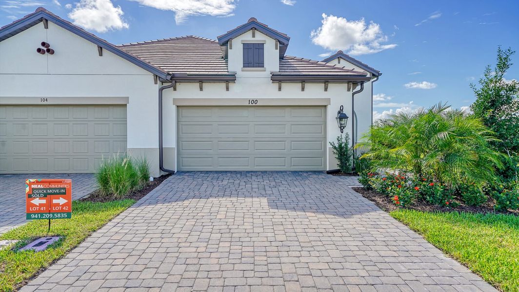 Front exterior of a new home in Vistera of Venice, Englewood, FL, highlighting curb appeal (Image 2).