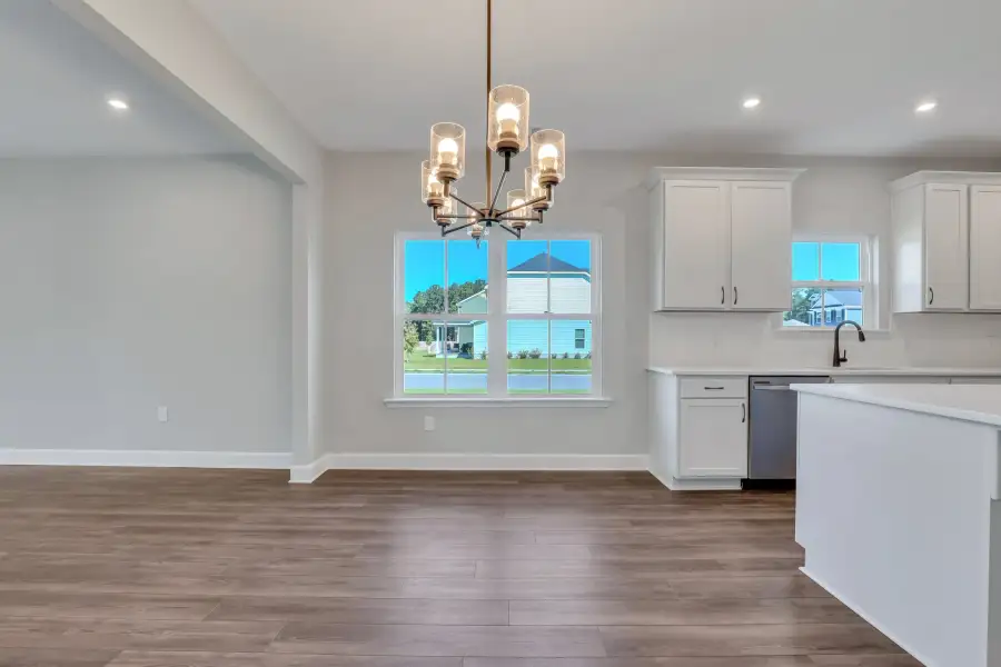 Sherwood – Dining Space with Chandelier and Windows