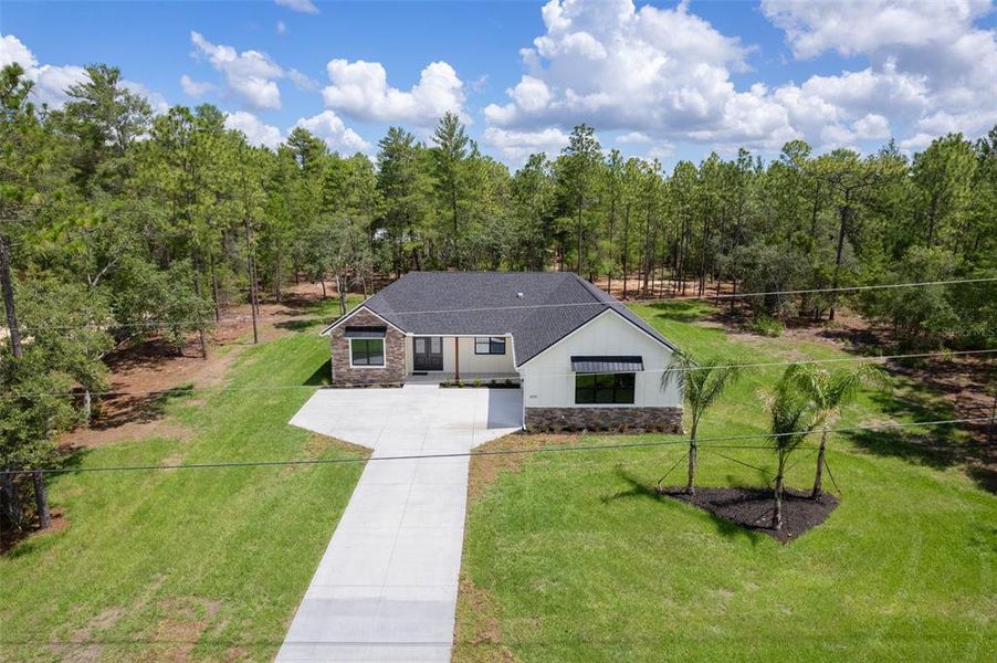 Front exterior of a new home in , Beverly Hills, FL, highlighting curb appeal (Image 29). Front exterior of a new home in , Beverly Hills, FL, highlighting curb appeal (Image 29).