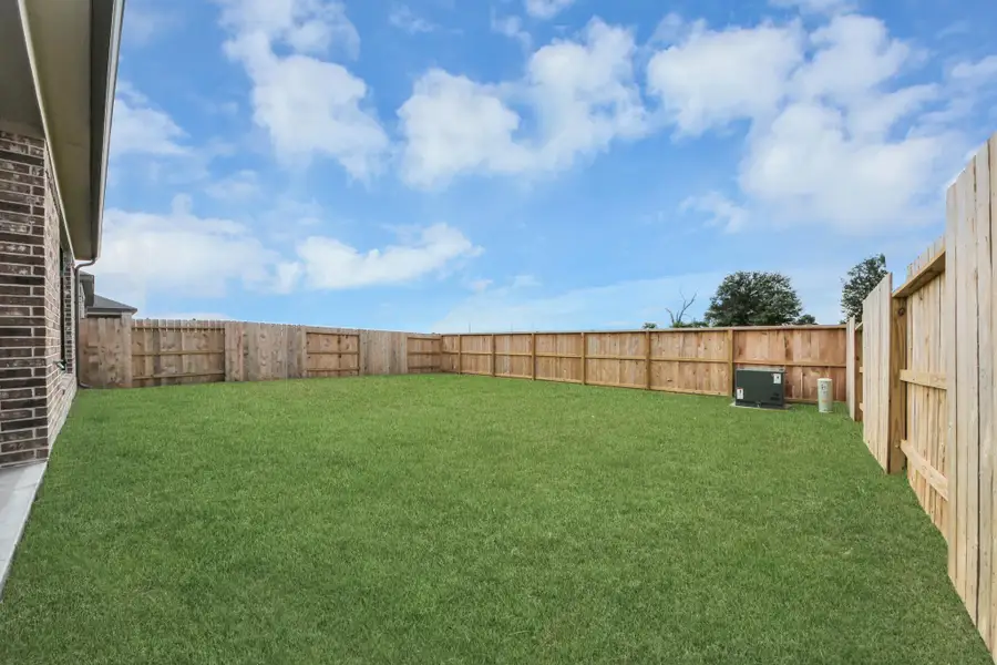 Backyard retreat, offering an abundance of space for kids to play and explore. The possibilities are endless in this outdoor haven, where the joy of open-air activities and family gatherings awaits.