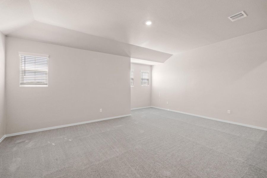 Carpeted empty room with plenty of natural light